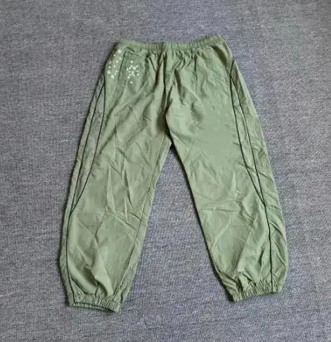 Supreme SS22 Week 3 AOI Glow-in-the-Dark Track Pants — green trousers colorway — USFans Spreadsheet photo